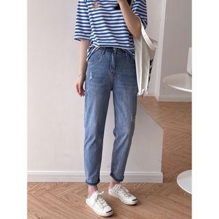 Mid Rise Distressed Tapered Jeans
