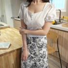 Set: Puff-sleeve Square-neck Crop Top + Floral Print A-line Midi Skirt
