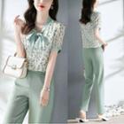 Set: Short Sleeve Tie-neck Floral Blouse + Plain Straight Leg Dress Pants