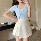 Short-sleeve Bow Accent Top / High-waist Asymmetrical Slit Mini Skirt