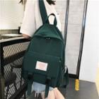 Tagged Buckled Strap Backpack
