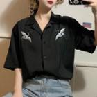 Crane Embroidered Short-sleeve Blouse