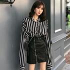 Striped Shirt / Mini Faux Leather Skirt