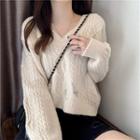 Distressed V-neck Cable-knit Sweater