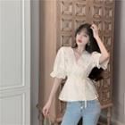 V-neck Embroidered Eyelet Tie-strap Blouse Light Almond - One Size