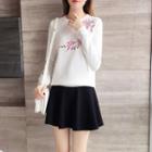Set: Long-sleeve Embroidered Knit Top + Mini A-line Skirt