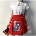 Short-sleeve Mock Neck Tasseled Top / Print Mini Pleated Skirt