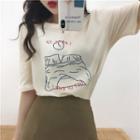Short-sleeve Printed T-shirt / High-waist Plain Midi Skirt