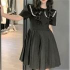 Short-sleeve Peter Pan Collar Embellished A-line Dress Black - One Size