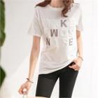 Crew-neck Embossed Lettering T-shirt