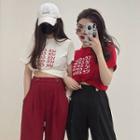 Lettering Print Crewneck Short-sleeve Top / Plain High-waist Wide-leg Pants