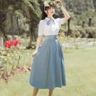 Set: Short-sleeve Tie Neck Shirt + Midi A-line Skirt