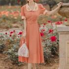 Short-sleeve Flower Embroidered Dotted Midi A-line Dress