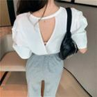 Short-sleeve Open Back T-shirt / High-waist Ripped Wide-leg Pants