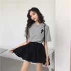 Short-sleeve T-shirt / High-waist Pleated Skirt