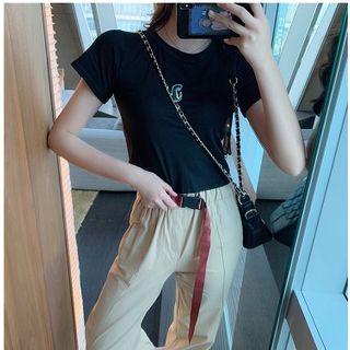 Short-sleeve Embroidered Cartoon Knit Top / Buckled Slit Cropped Harem Pants