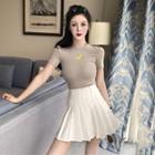 Short-sleeve Moon Print Top / Mini Pleated Skirt