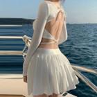 Long-sleeve Ribbed Cropped T-shirt / Pleated A-line Skirt