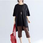 Pocketed 3/4 Sleeve Loose-fit T-shirt
