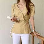Wrap-front Tie-waist Peplum Top