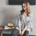 Tie-neck Flared Patterned Blouse