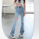 High-waist Distressed Flared Jeans