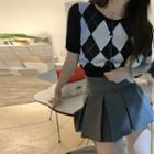 Short-sleeve Argyle Print Cardigan / Pleated A-line Skirt