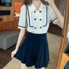 Set: Short Sleeve Double Breasted Contrast Trim Blouse + Pleated Mini Skirt