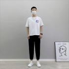 Short-sleeve Bear Print T-shirt / Lettering Cropped Harem Pants / Set
