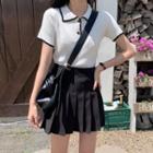 Short-sleeve Knit Polo Shirt / Mini A-line Pleated Skirt