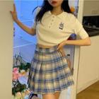 Printed Polo Shirt / Pleated Plaid Mini Skirt