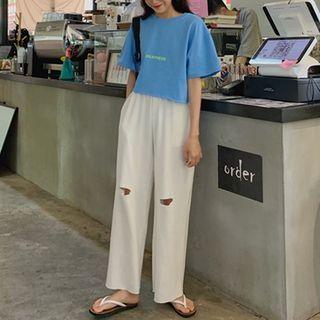 Lettering Short-sleeve Cropped T-shirt / Ripped Wide Leg Pants