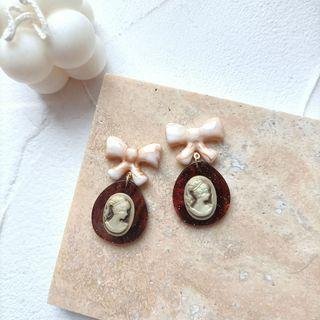 Bow Embossed Resin Dangle Earring