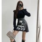 Eyelet Padded-shoulder Knit Top / Asymmetrical Faux-leather Printed Mini Skirt