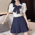 Set: Short-sleeve Bow Crop Top + Pleated Mini A-line Skirt