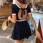 Set: Short-sleeve Open-back Swimsuit + Cover-up Skirt