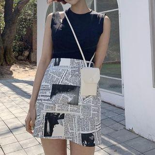 Sleeveless Cut Out T-shirt / Newspaper Print A-line Skirt