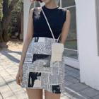 Sleeveless Cut Out T-shirt / Newspaper Print A-line Skirt