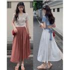 Short-sleeve Tie-back T-shirt / A-line Midi Skirt