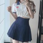 Cropped T-shirt / Pleated Mini A-line Skirt
