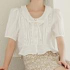 Short-sleeve Tie-neck Ruffle-hem Cropped Blouse