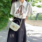 Short-sleeve Tie-neck Shirt / Midi A-line Skirt