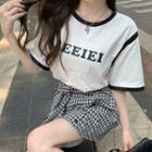 Two-tone Lettering T-shirt + Plaid A-line Mini Skirt