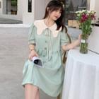 Short-sleeve Peter Pan Collar Tie-strap Buttoned Accordion Pleat Dress