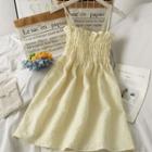 Embossed Sleeveless Smocked Mini Dress