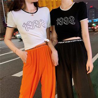 Lettering Short-sleeve T-shirt / Cropped Harem Pants