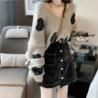 Embroidered Heart Sweater / Faux Leather Buttoned A-line Mini Skirt