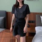 Short-sleeve Cutout T-shirt / Asymmetric Mini Fitted Skirt