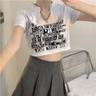 Short-sleeve Lettering Cropped T-shirt / Pinstriped Mini Pleated Skirt