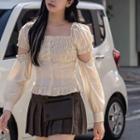 Cut-out Sleeve Ruffled Blouse